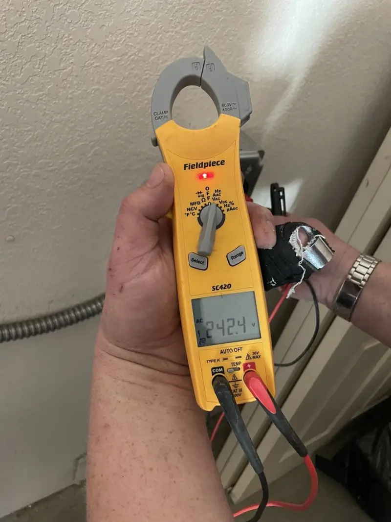 Voltage testing with clamp meter during Outlet Installation in Cascade Valley